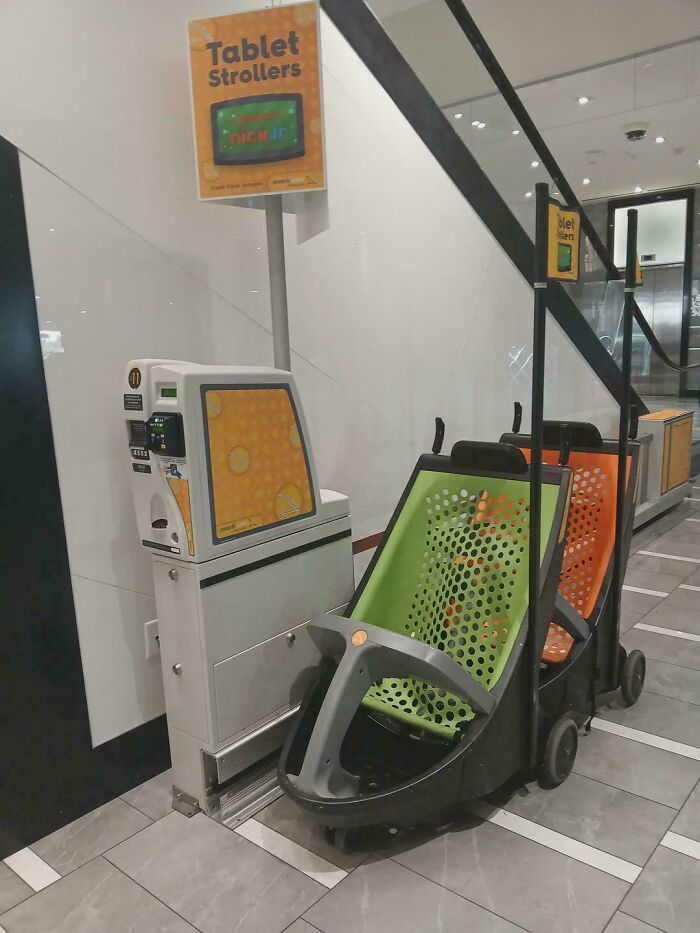 Tablet strollers in a shopping mall, illustrating consumerism trends affecting the peasant class distractions.