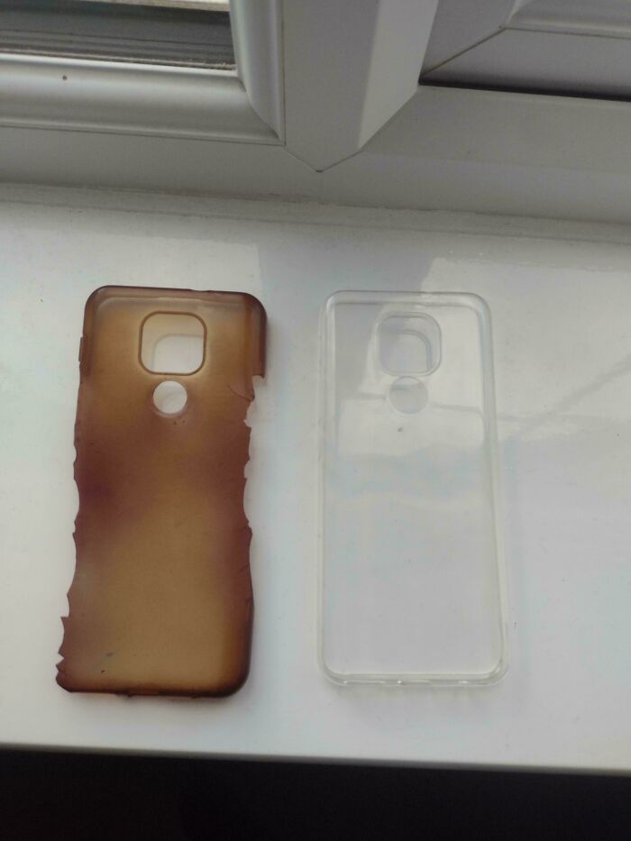 Two phone cases on a windowsill, one clear and new, the other moderately interesting and burnt from heat exposure.