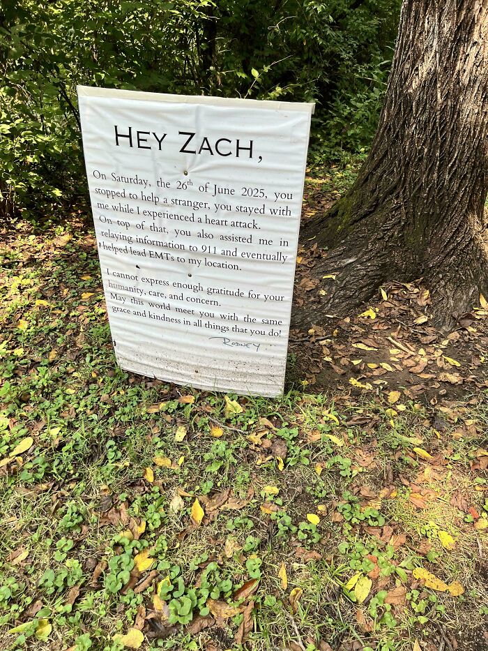 Sign expressing gratitude to a stranger who helped during a heart attack, shared as a moderately interesting moment.
