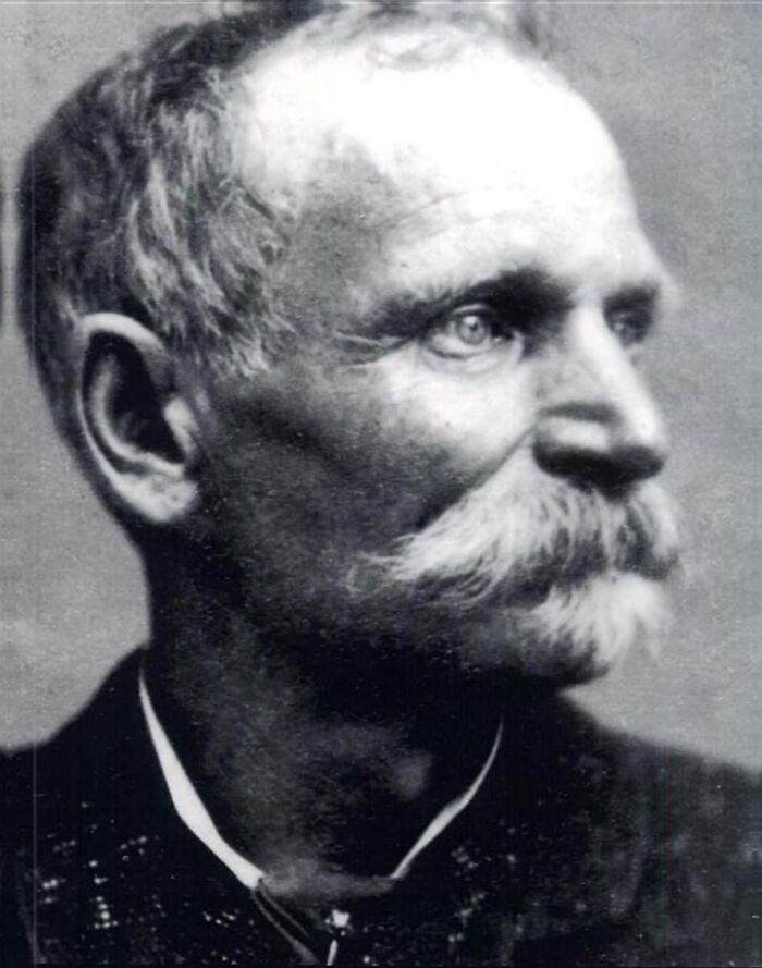 Black and white profile portrait of an older man with a mustache, representing American folk heroes in history.