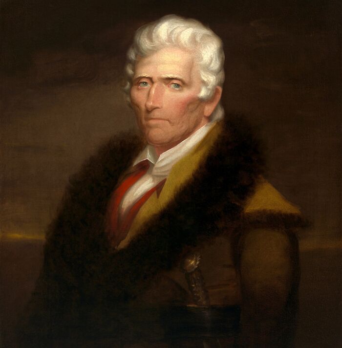 Portrait of an American folk hero with white hair wearing a dark fur-lined coat, representing legendary American folk heroes.