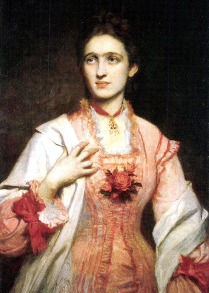 Victorian-era woman in detailed dress featuring floral accents, illustrating bizarre and creepy Victorian facts and history.