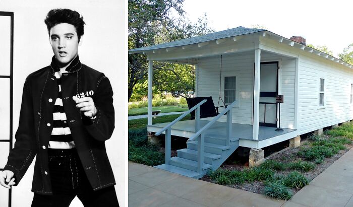 Black and white photo of a young Elvis Presley next to a small white wooden childhood home outdoors.