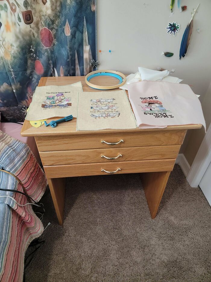 An embroidery creation workstation with hoops and various fabric pieces, inspiring creative hobby projects.