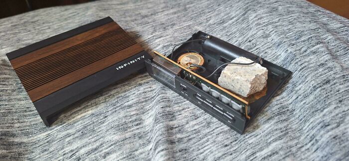 Vintage cassette tape player opened, revealing unusual internal components, captured as a moderately interesting share.