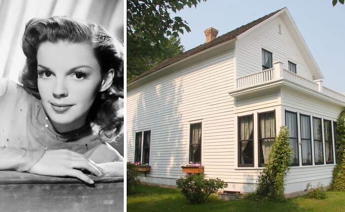 Black and white portrait of a young woman next to a white wooden childhood home with a garden and flowers outside.