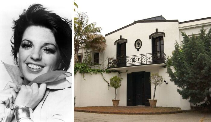 Celebrity childhood home with white exterior, black trim, balcony, and palm trees, showcasing humble beginnings.