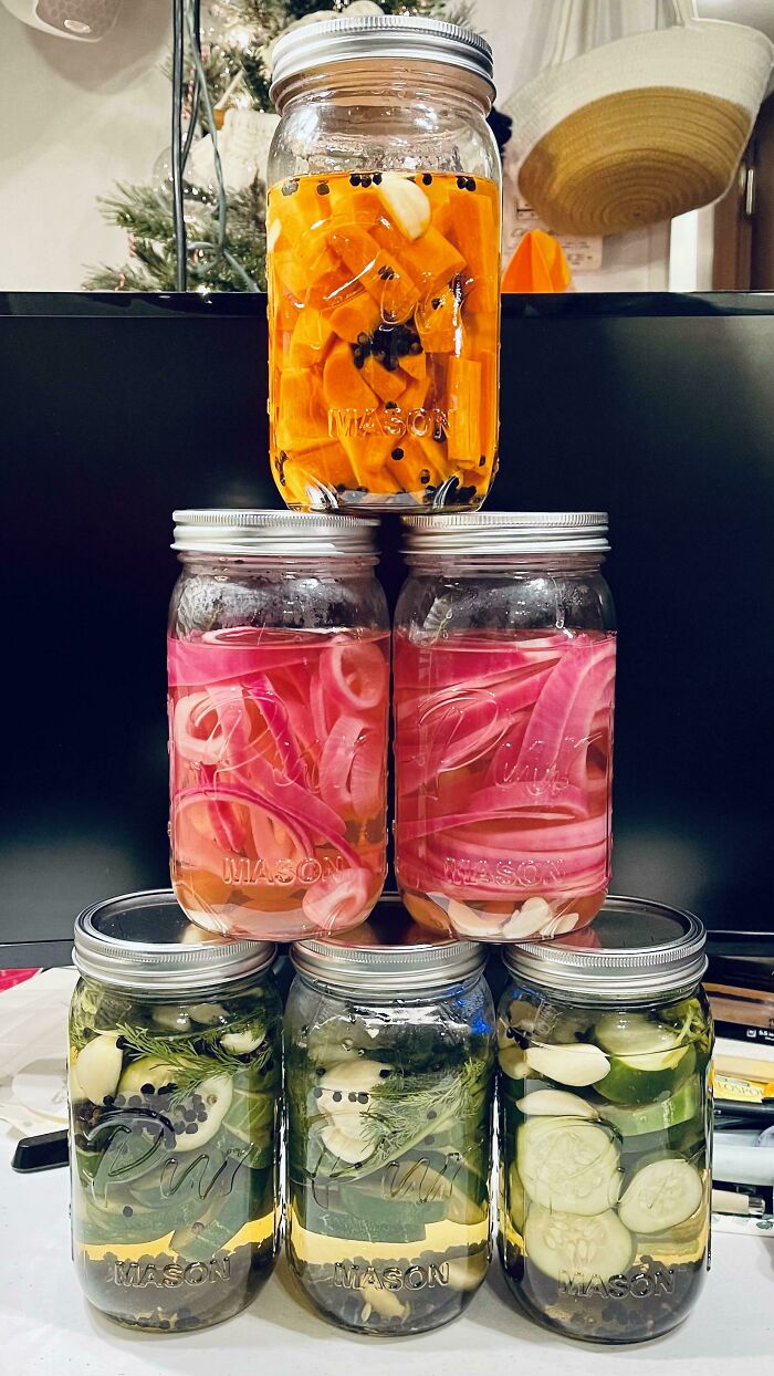 Six mason jars filled with colorful pickled vegetables, demonstrating easy kitchen tricks for enhancing your cooking game.