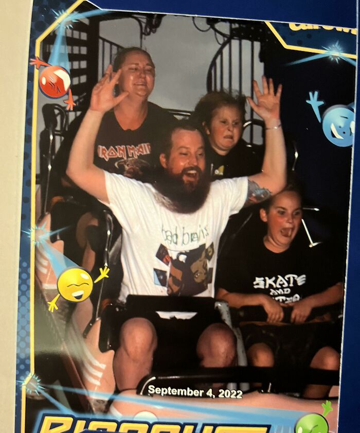 Family on a roller coaster ride showing excitement and fear captured in one of the best photos from an amusement park trip.
