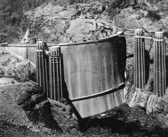 An eerie, extremely large dam under construction, showcasing the immense scale of engineering and human effort.