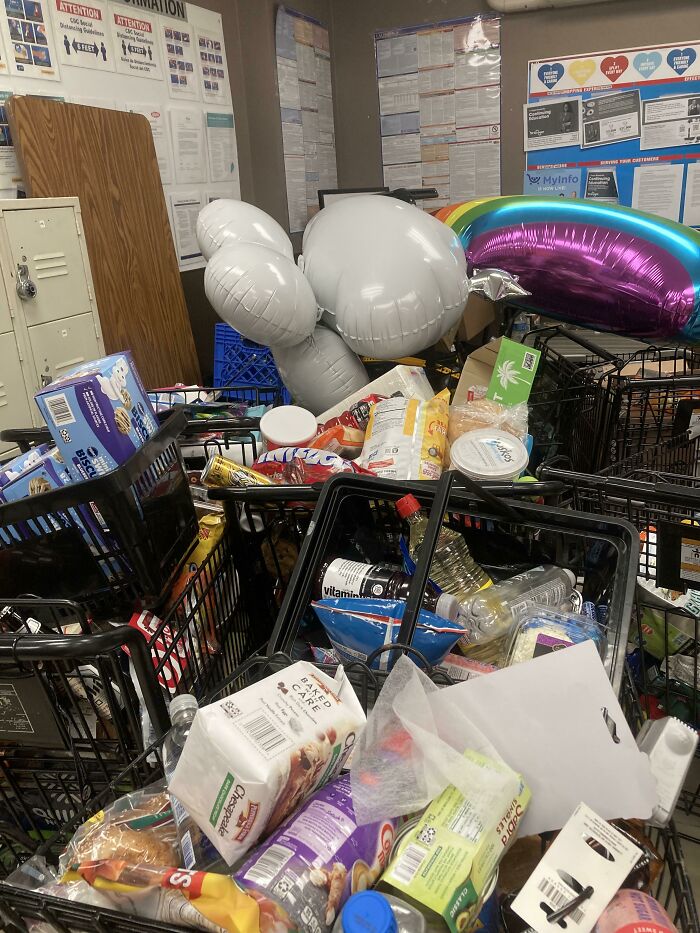 Cluttered break room with endless shopping carts filled with snacks and drinks, resembling one of the worst break rooms.