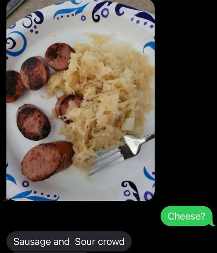 Plate with sausage slices and sauerkraut mistakenly called cheese in a humorous example of being embarrassingly wrong.