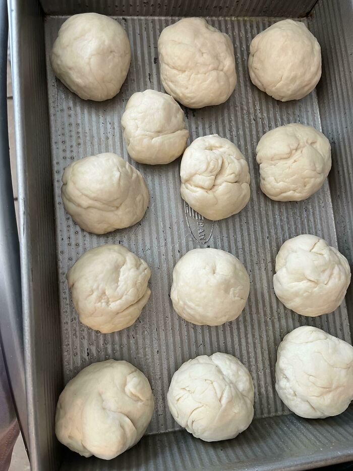 Rising dough in a bowl inside a refrigerator, showcasing easy kitchen tricks to improve your cooking game.