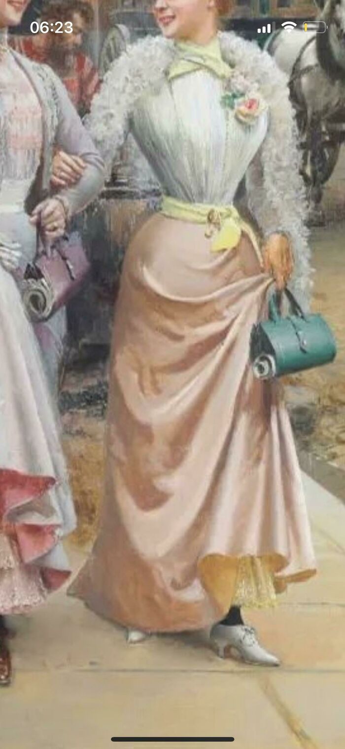 Two women in vintage dresses holding purses, showcasing curious things people discovered with no idea what they were.