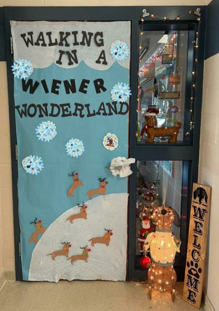 Classroom door decorated with a funny teachers humor theme featuring reindeer and snowflakes in a winter scene.