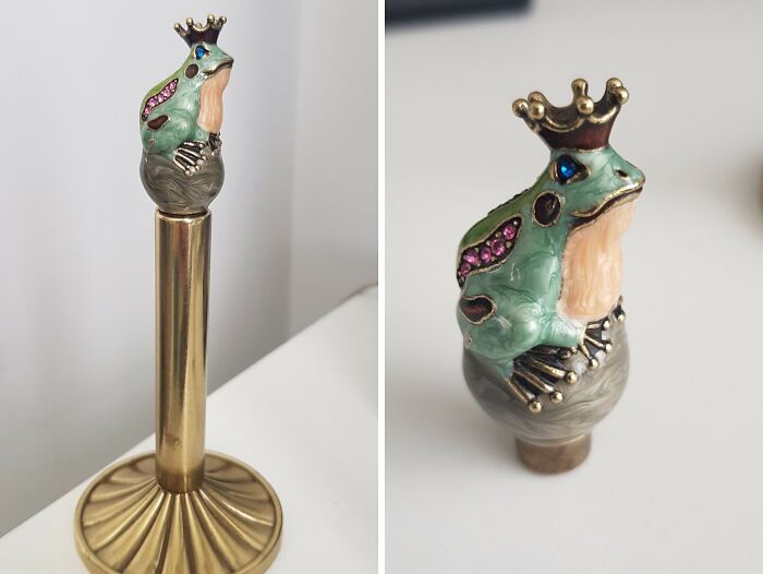 Close-up of a decorative frog-shaped finial with a crown, one of the curious things people discovered and had no idea what it was.