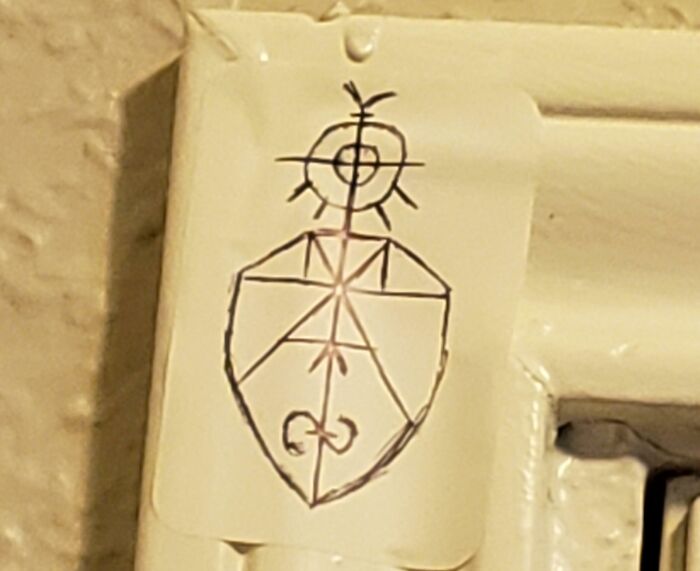 Close-up of a mysterious symbol drawn on a wall, one of the curious things people discovered and had no idea what it was.
