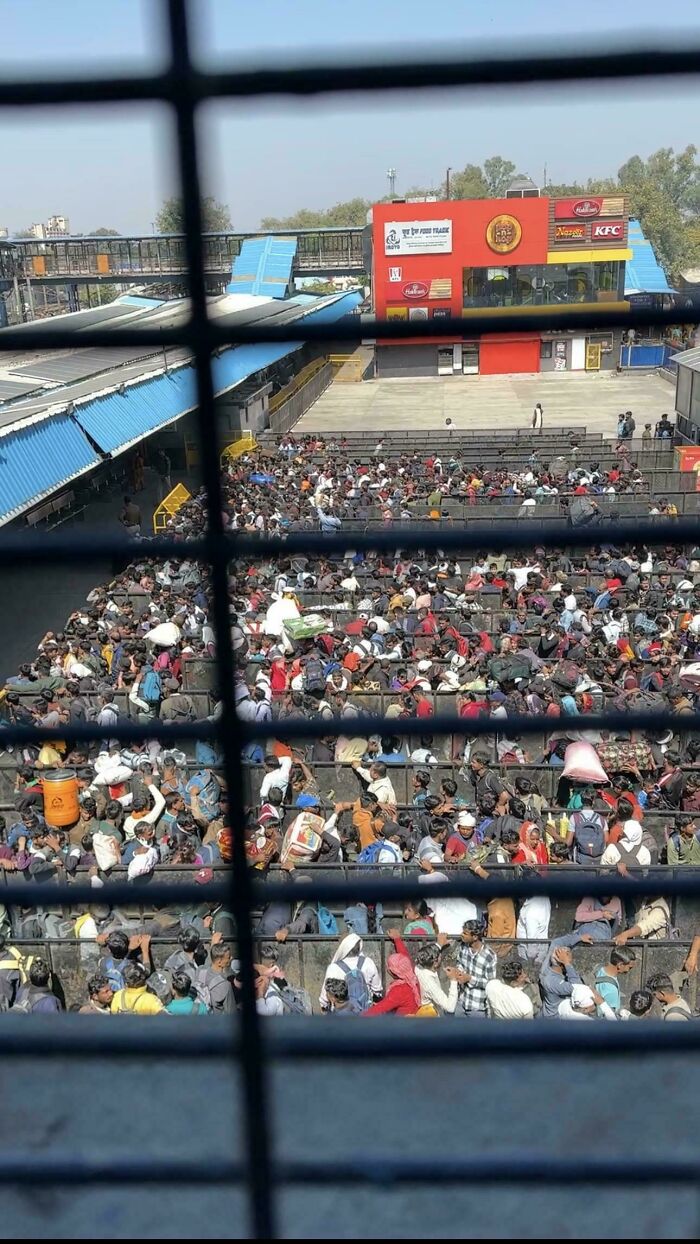 Crowded urban scene with many people packed tightly, illustrating urban hell and issues within modern society.