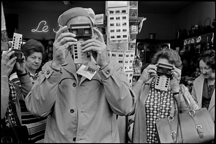 People’s lives captured in old photos with vintage film viewers in a black and white setting showing a different time.