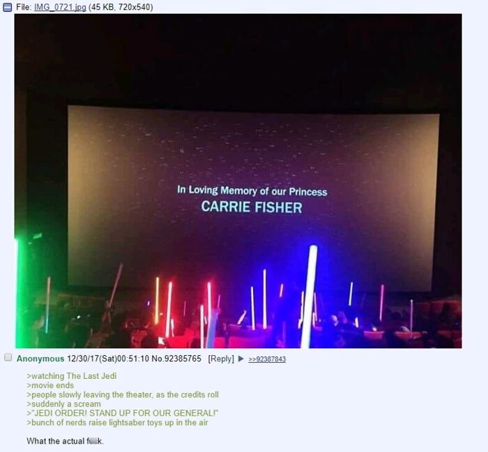 Fans raise colorful lightsabers during a heartfelt tribute to Carrie Fisher, a cringe-worthy but wholesome movie moment.