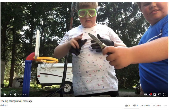 Two boys outdoors with one wearing safety goggles and holding tools, capturing a cringe-worthy but wholesome moment.