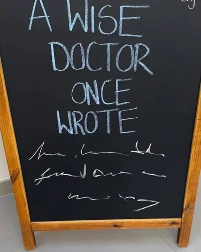 Chalkboard sign humorously showing a wise doctor’s illegible handwriting as a funny and bizarre image.