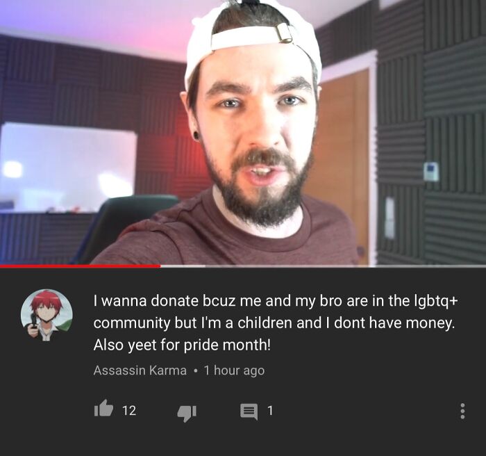 Man with beard and backward cap in a recording room with a cringeworthy but wholesome LGBTQ+ community comment.