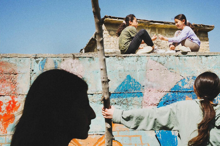 Children playing and interacting outdoors in Turkey, capturing the real candid side of life through authentic moments.