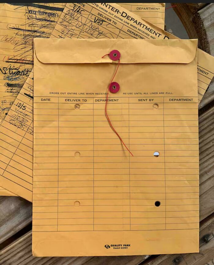 Vintage inter-department envelopes with handwritten notes, showcasing nostalgic items to make you feel old as heck.