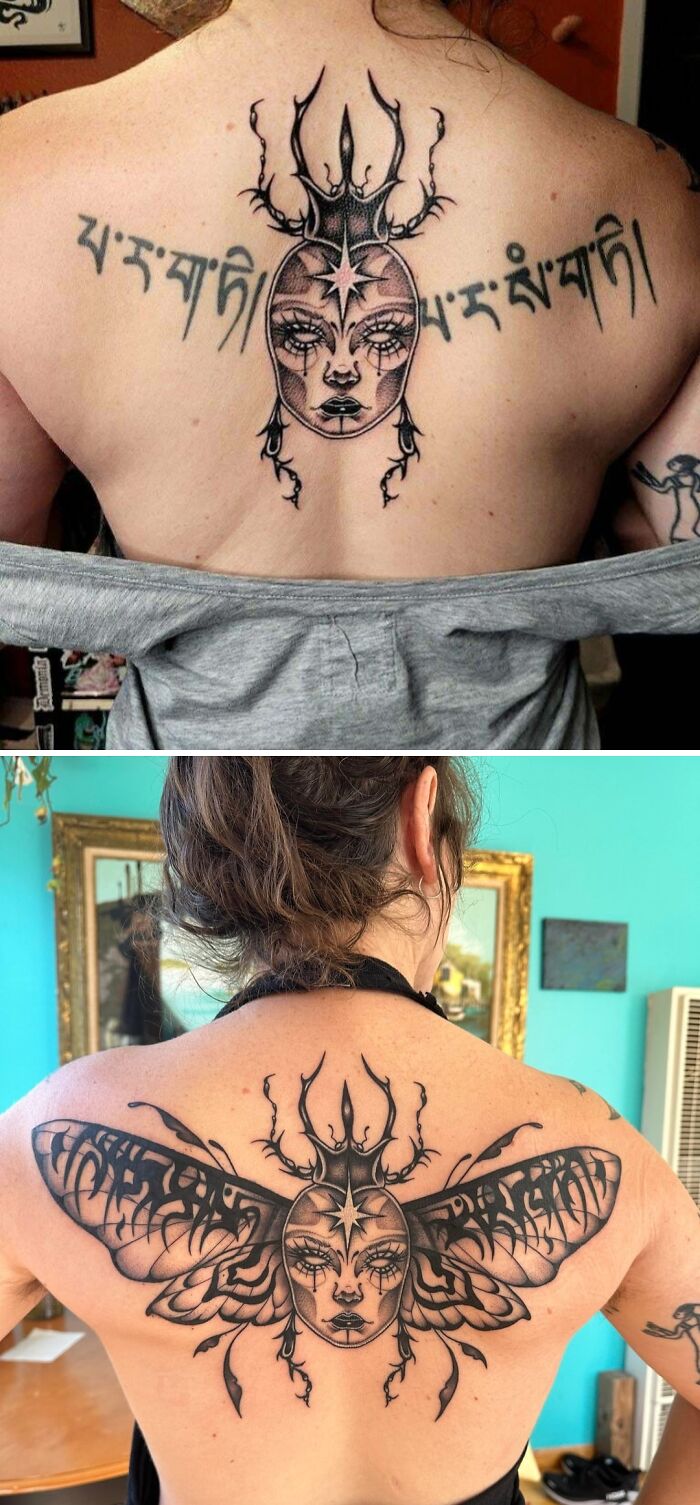 Black ink tattoo cover-up showing detailed face and intricate wings transforming previous tattoo on woman’s upper back.