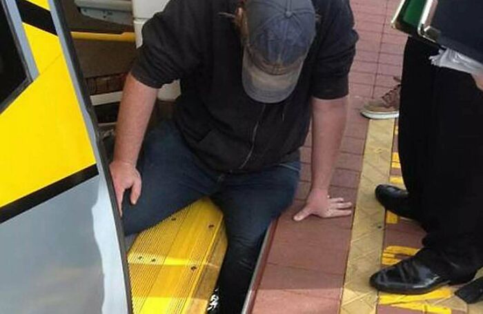 Man stuck between train and platform edge, highlighting heartwarming stories of kindness and hope amid world’s negativity.