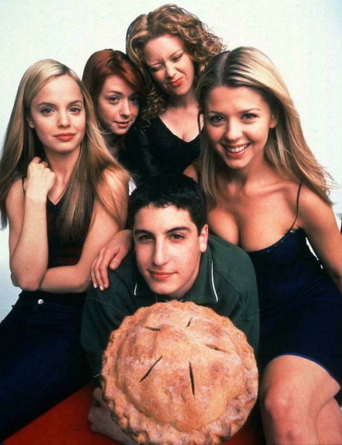 Cast of a 90s teen movie posing with a pie, evoking funny 90s posts and memes from childhood memories.
