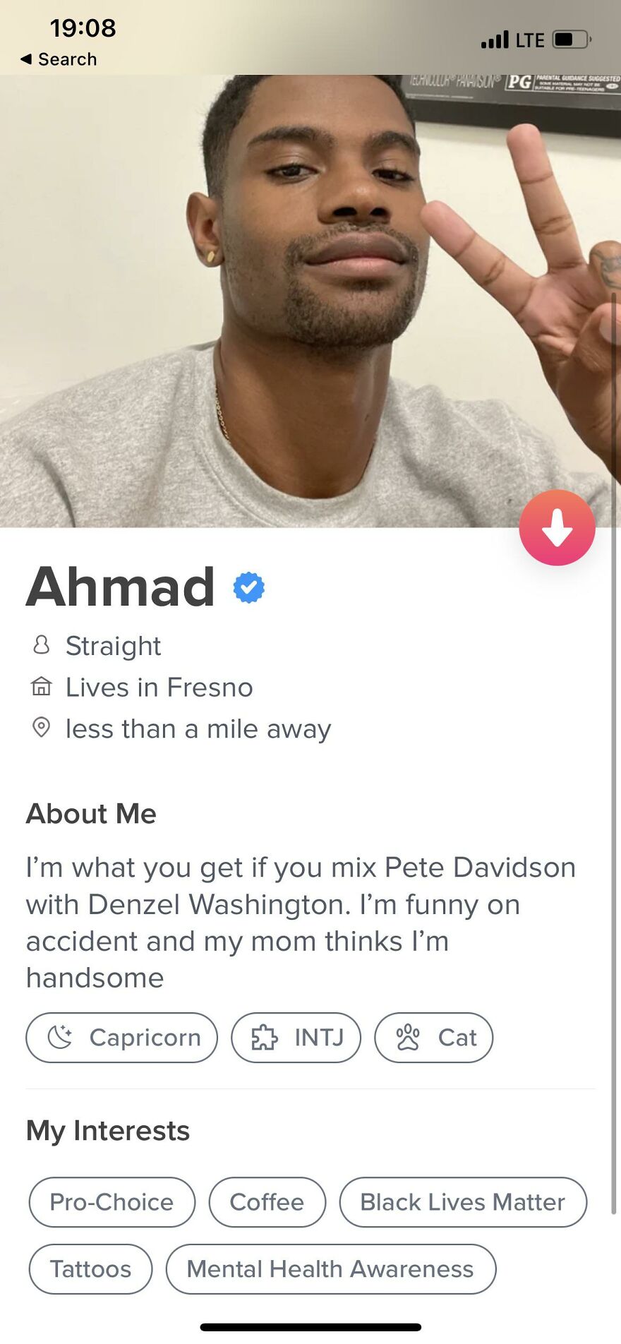 Tinder profile of a guy named Ahmad showing a confident selfie and creative Tinder bios for guys with interests and personality traits.
