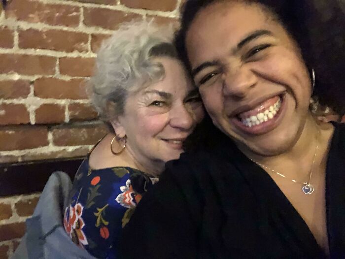 Smiling mother and daughter sharing a funny and wholesome moment, capturing the joy of parents with their kids.