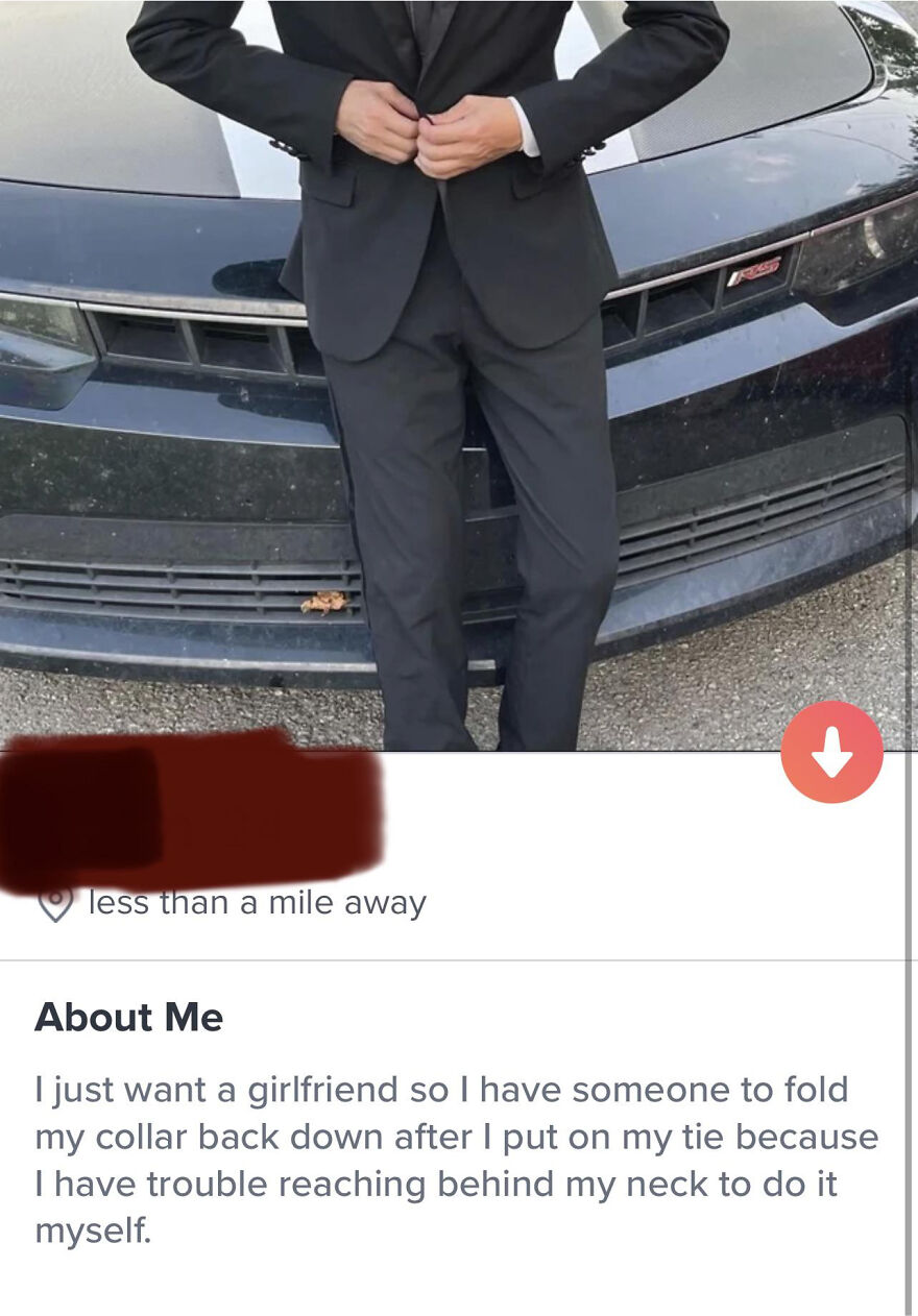 Man in a black suit adjusting his jacket in front of a car, showcasing a funny Tinder bio for guys on a dating profile.
