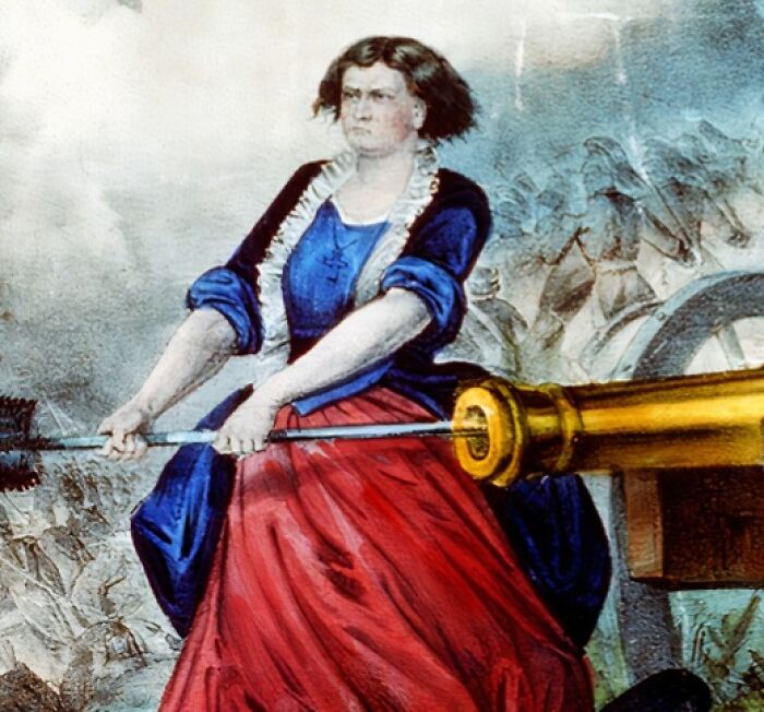 Female American folk hero in a blue and red dress operating a large cannon during a battle scene from folk hero stories.