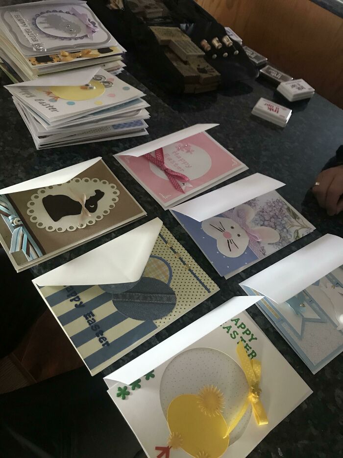 Stack of colorful Easter greeting cards on a table, showcasing heartfelt and wholesome moments for moms.