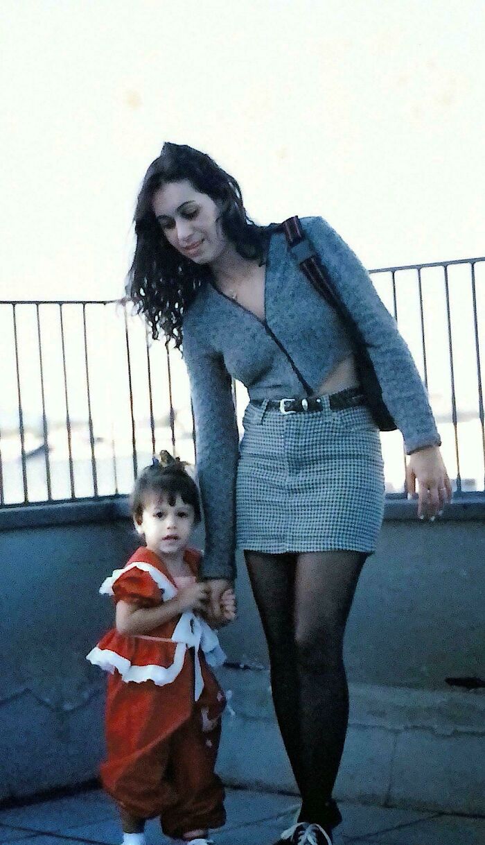 Woman and child dressed in 90s fashion, capturing a nostalgic moment for funny 90s posts and memes about childhood memories.