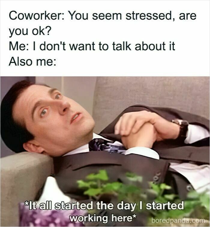 Man in a suit lying down with a stressed expression, shown in a relatable work meme about stressful work moments.