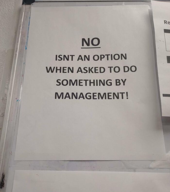 Printed sign stating no isn't an option when asked to do something by management, illustrating why people hate their boss.