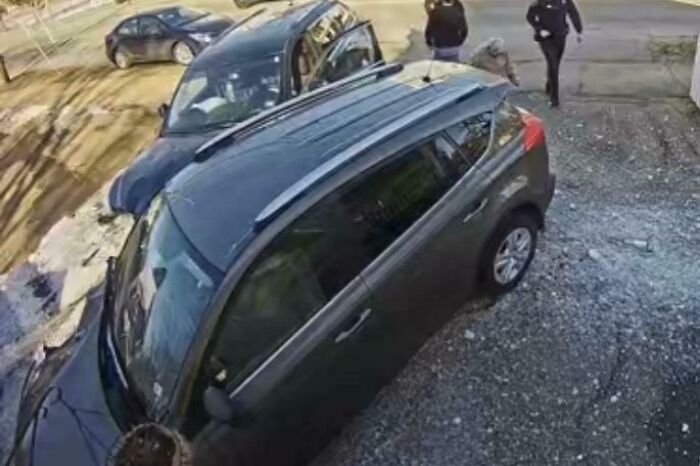 Two cars crashed on a gravel road with police officers inspecting the scene, capturing worst luck on vacation moments.