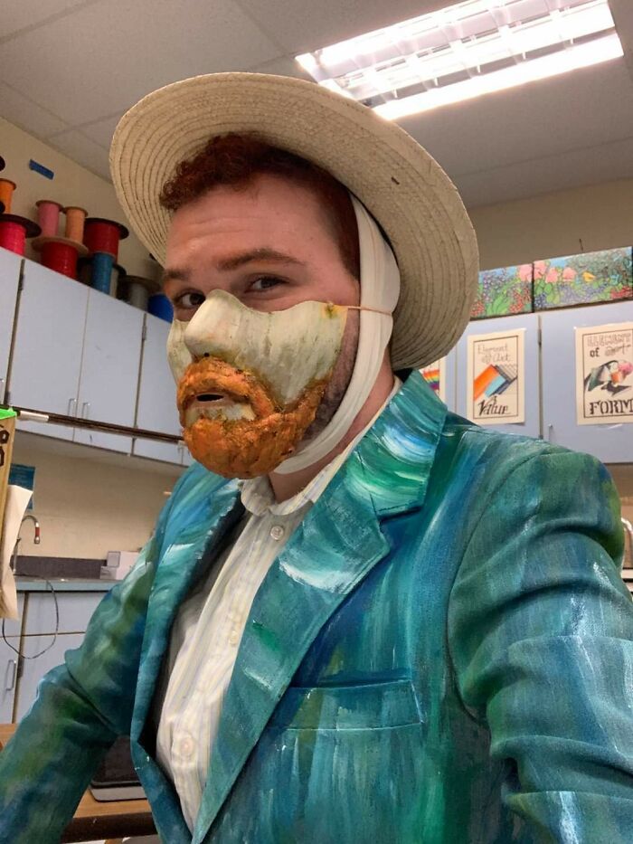 Teacher wearing a humorous Van Gogh-inspired mask and painted suit in a classroom, showcasing funny teachers' creative sense of humor.