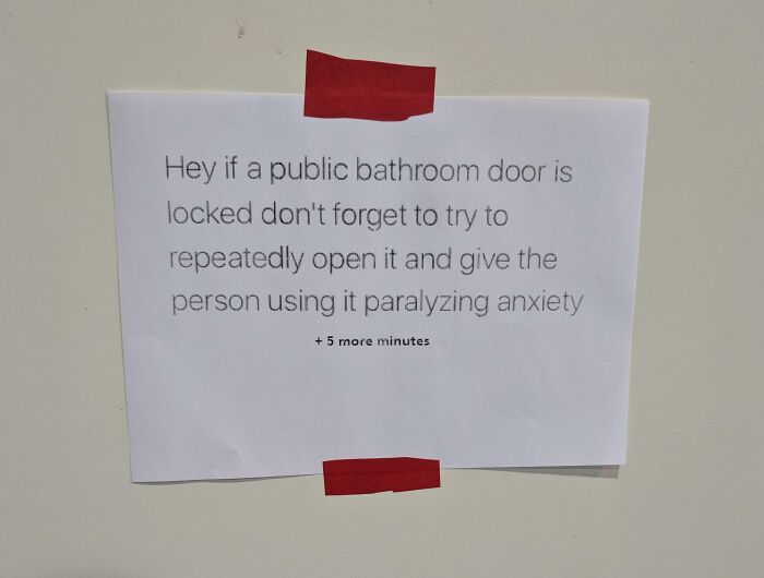 Passive-aggressive note taped on wall sarcastically addressing public bathroom door behavior in a coworker setting.