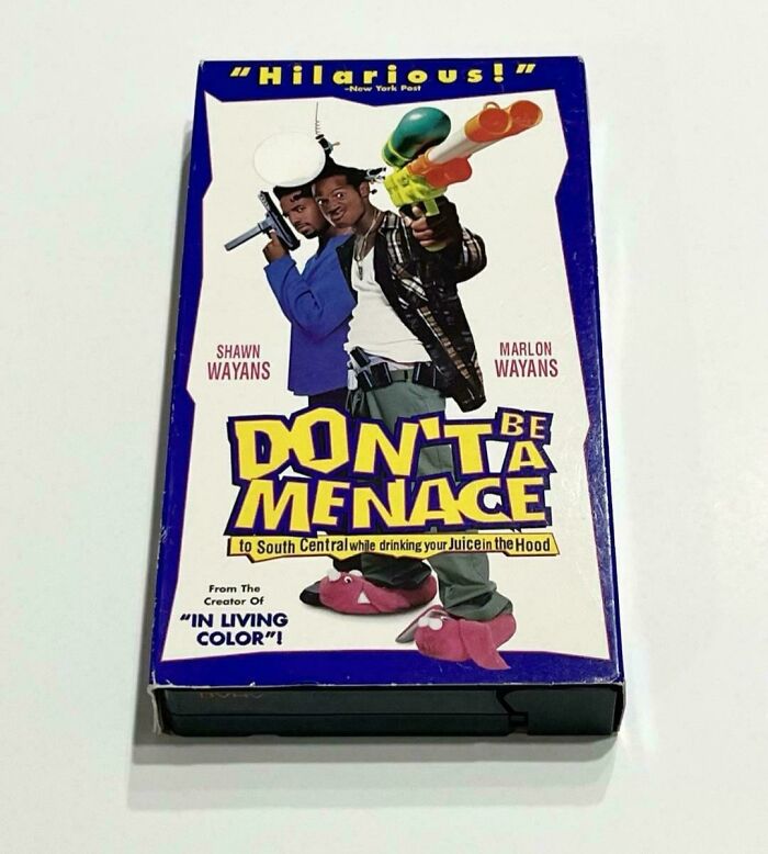 DVD cover of 90s comedy Don't Be a Menace featuring Shawn and Marlon Wayans holding toy guns and dressed in casual clothes.