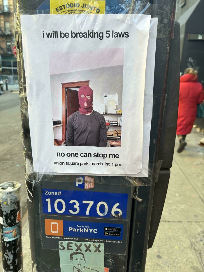 Poster on a street pole with a masked person and text about breaking laws, related to Devil Sunrise interesting photos.