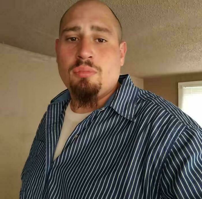 Man with goatee wearing a striped shirt indoors, representing still remains undiscovered to this day concept.