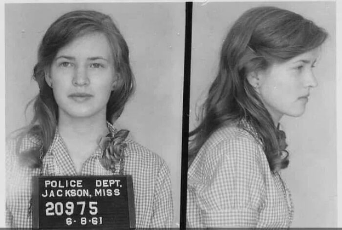 Black and white vintage police mugshot of a young woman, representing facts still remains undiscovered to this day.