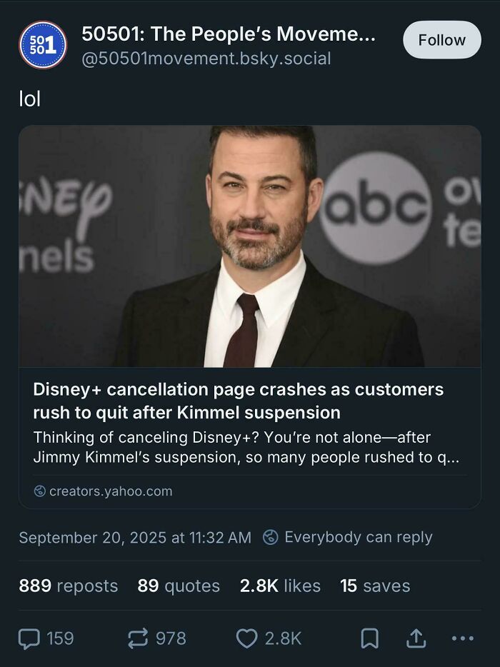 Man in a suit with a beard at an event, smiling slightly with was-an-attempt-fail-pics vibe.