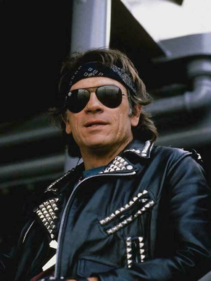 Man wearing studded leather jacket, bandana, and sunglasses representing funny ’90s posts and memes nostalgia.