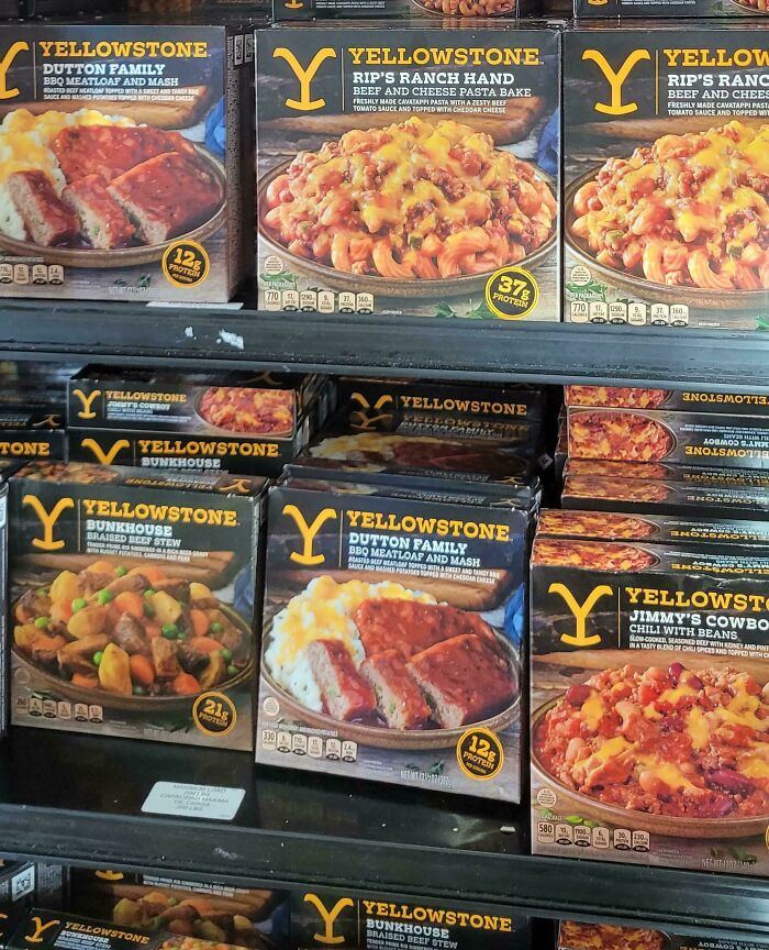 Frozen Yellowstone meals including beef pasta bake, meatloaf, and stew on a grocery store shelf showcasing nonsensical food products.